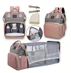 Multifunctional diaper bag with organizer, changing mat, and baby care items on a white background.